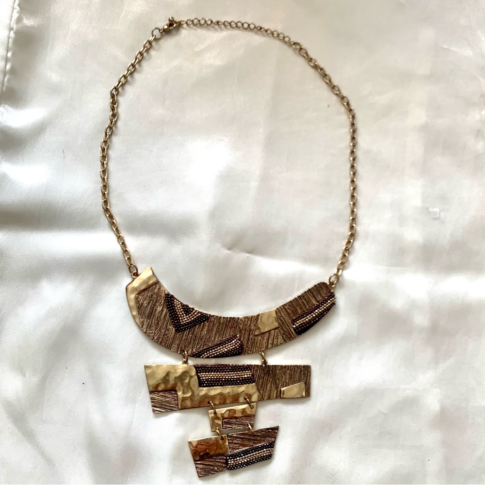 Artsy goldtone tiered bib necklace
